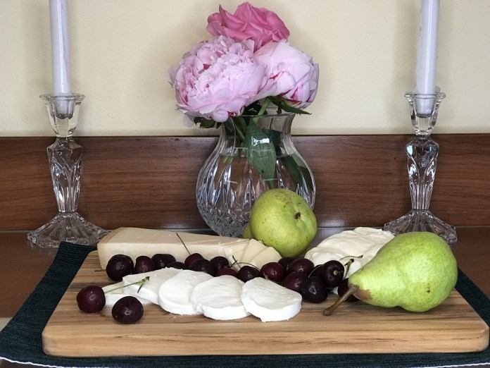still life fruit cheese peonies